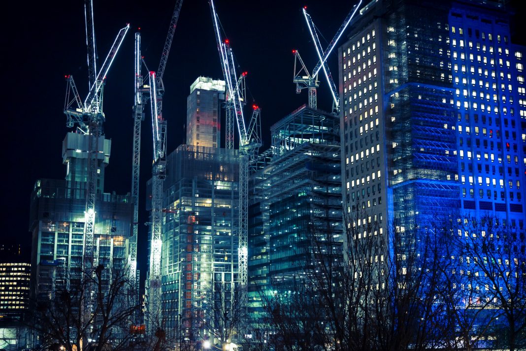 Construction site near Waterloo Station at night, London, England, UK construction industry, no deal, building materials,