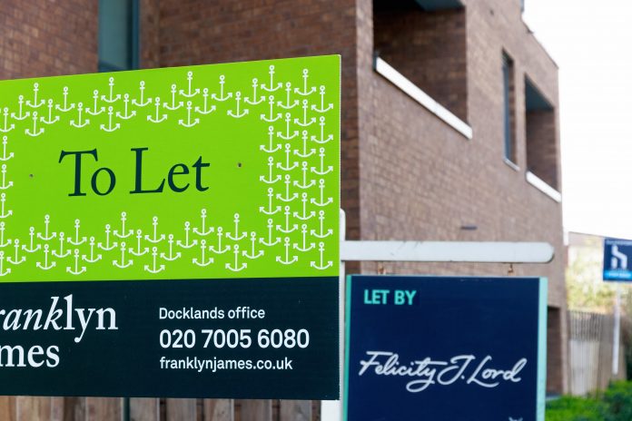 To Let signs outside a English townhouse Build to Rent Summer 2019,