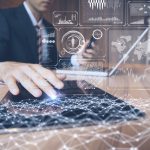 businessman using tablet PC and information communication technology concept. IoT(Internet of Things). GUI(graphical user interface). paperless office.