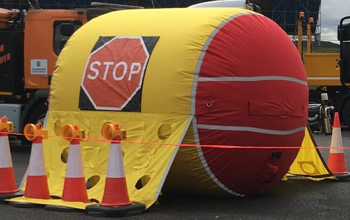 Inflatable safety barrier to protect Highways England road workers inflatable safety barrier,