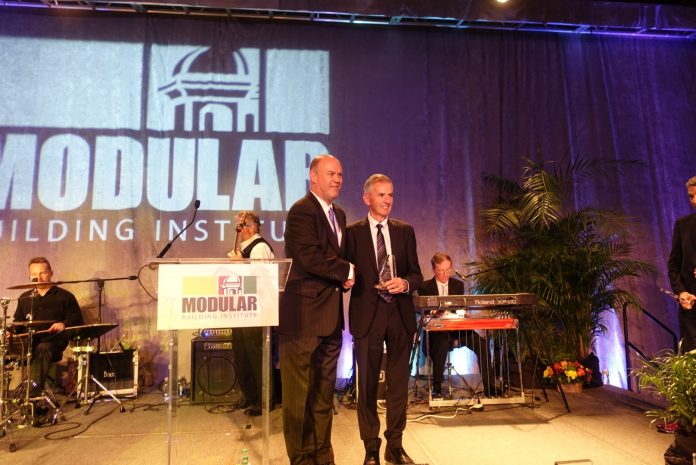 John Fleming presented with the Excellence in Innovation Award world of modular