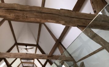 wooden beams in listed barn conversion