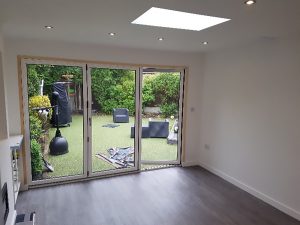 inside of home extension back room looking onto garden