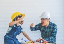Father and Son fist bump for success concept in construction