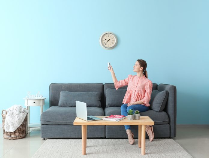 Stock image of woman on a sofa