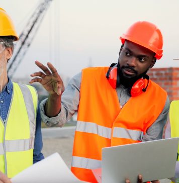 stock image of construction workers on site
