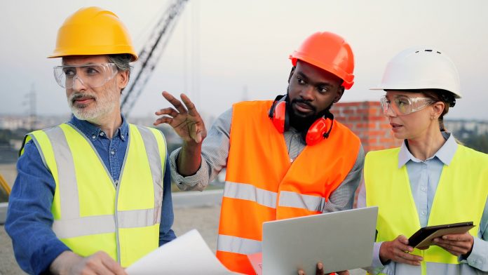 stock image of construction workers on site