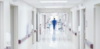 Doctor walking down hospital corridor