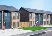 new build housing development, modern terraced houses with front gardens and driveway