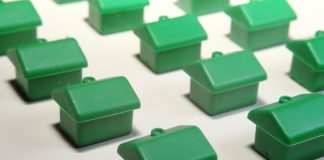 little green Monopoly houses