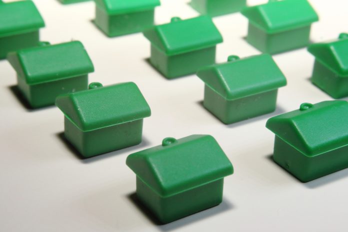 little green Monopoly houses