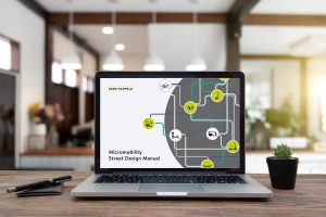 Micromobility Street Design Manual front cover on laptop 