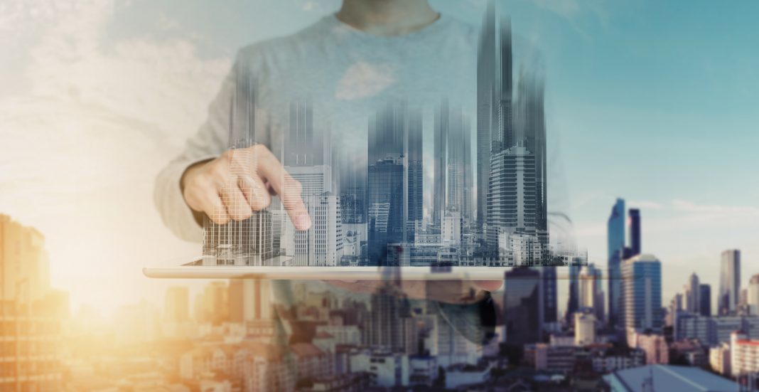 stock image of person standing above digital city