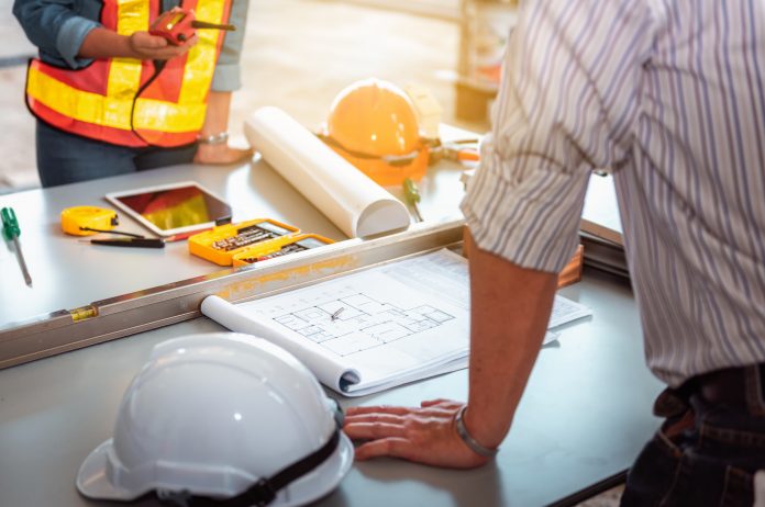 Project management team of engineers and achitects planning for new project