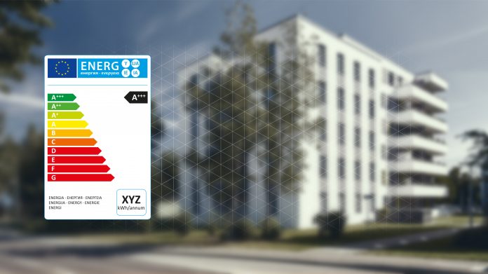 Energy label in front of apartment building as a consumption concept