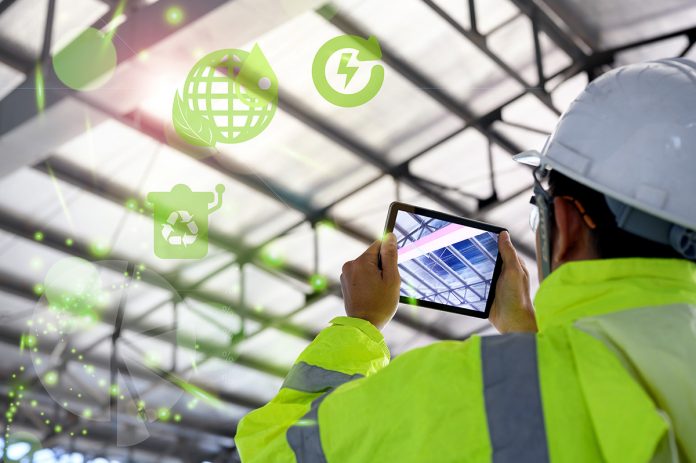 Construction Civil Engineer use technology software through tablets to scan building construction and inspection to show augmented reality in work, Building information model or BIM concept
