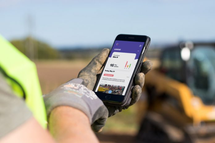 Construction worker using mobile app onsite