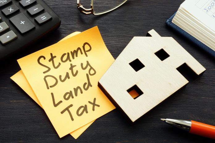 Stamp duty cuts written on yellow post it note