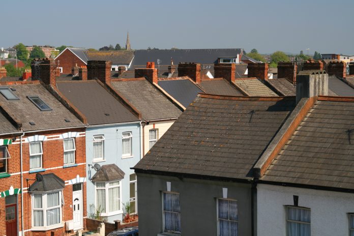 Junction view of victorian tenement housing in an article about house prices