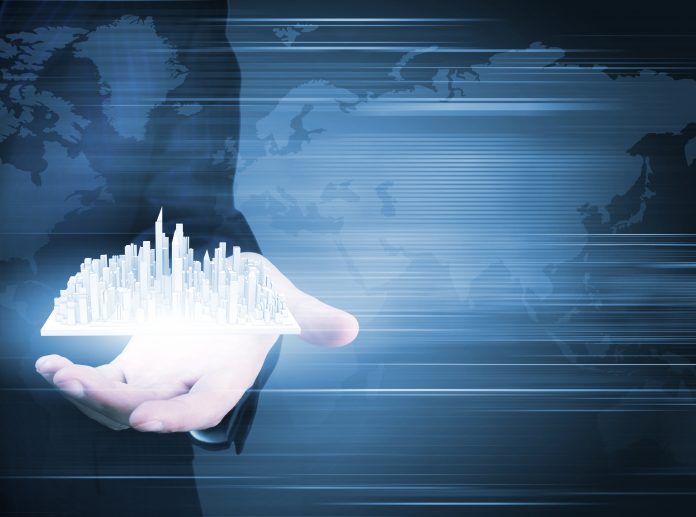 dreamstime_xxl_48725990 Close up of businessman holding digital construction model in palm to represent Q3 2022 operating results