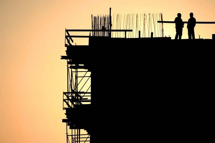 collaboration corner: two construction workers on site