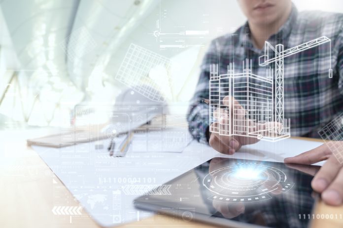 Engineer or Architect looking and touching interface with building design reality virtual technology on computer tablet at modern