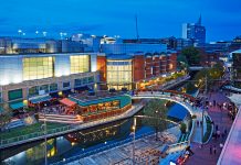 RICS training and conferences Aerial,View,Of,The,'oracle',Shopping,Centre,Illuminated,At,Dusk