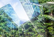 Nemetschek Group tackles energy crisis with Spacewell energy solution green city - double exposure of lush green forest and modern skyscrapers windows
