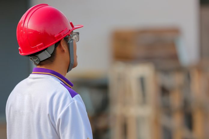 From disruption to reinvention: How can construction technology rebuild the industry? Construction worker wearin construction technology hardhat