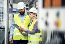 What is the purpose of a Permit to Work system? two construction workers using Elecosoft permit to work system