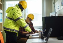 3 ways the Last Planner System can drive successful project outcomes Two male engineers with the hardhats looking at the blueprints in their office at the construction site - planner system