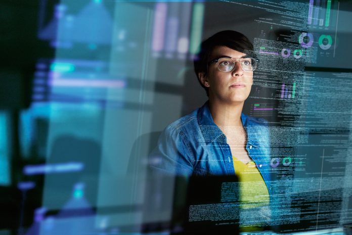 Cropped shot of a young computer programmer looking through data - digital skills gap