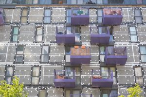 Re-cladding work in progress on a block of flats in Stratford, London, England