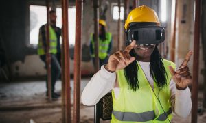 women using VR technology on construction site