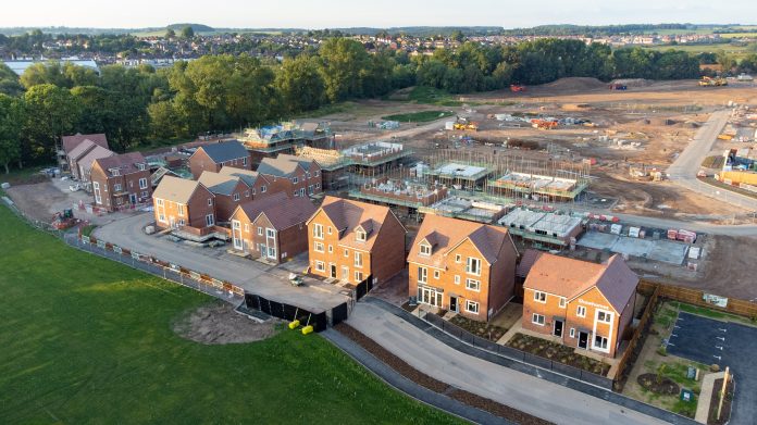 Aerial view of new build housing construction site in England, UK NPPF topics