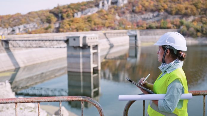 Maintenance female engineer working in hydroelectric power station. Renewable energy systems. Northumbrian Water Group