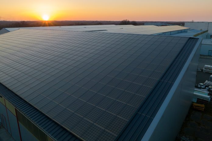 image of rooftop solar PV on warehouse, green energy
