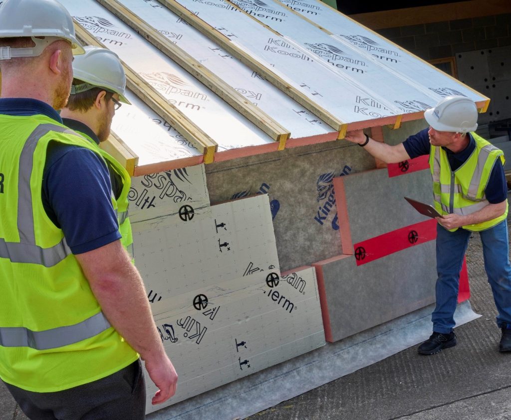 Image of workers installing thermal panels