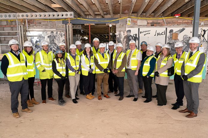 Image of contractors standing on the site of new Morgan Sindall appointed to lead construction of carbon-neutral school in Wales