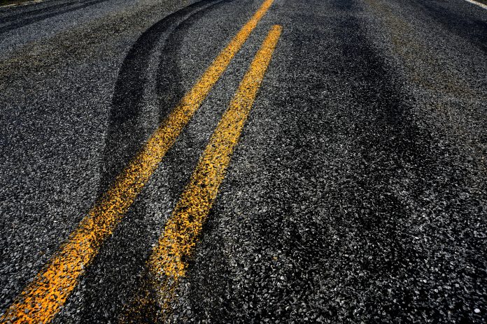 car skid marks on road - road safety improvements in England
