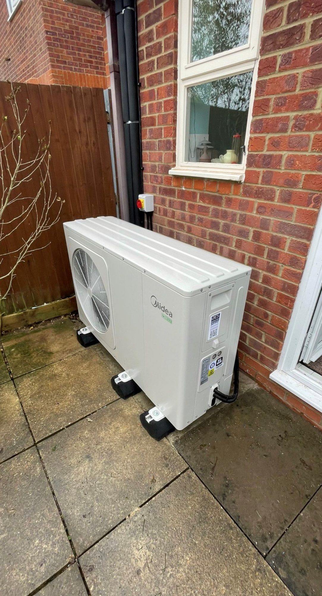 AES air-source heat pump outside of residential home
