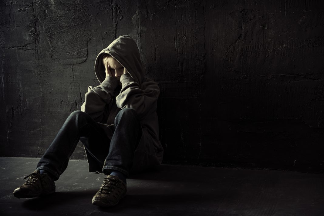 A lonely boy represents fighting modern slavery in the supply chain