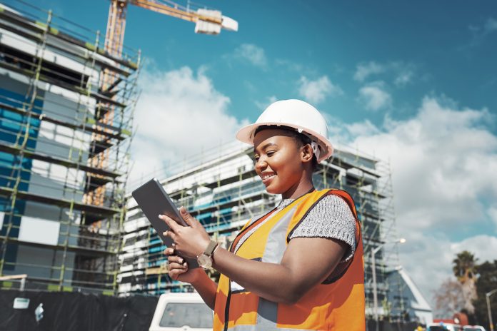 female construction worker - estimating software