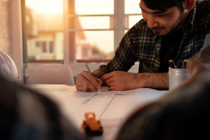 Aston University launches new BIM course Architecture Designer Draft and Design in the worksheets revised for construction for the future on the desk at home. Work From Home, Self-quarantine stay home concept