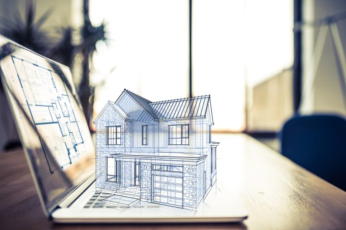 BIM Technology - hologram of house on laptop