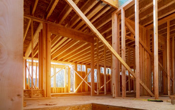 EAC urges the UK to use more wood in construction to achieve net-zero targets timber frame building - wood in construction