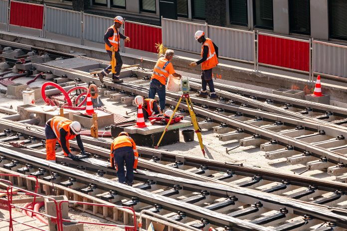 construction workers on train track - HS2 programme