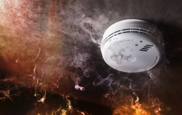 Fire safety experts urged to apply for LHC’s £140m Fire Safety (FS2) Framework Smoke detector and fire alarm in action background with copy space, representing the Fire Safety (FS2) Framework