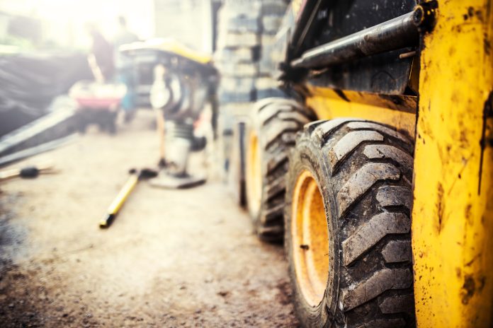 What you need to know when it comes to safeguarding construction plant and equipment Yellow bobcat on a construction site, representing the need for safeguarding construction equipment