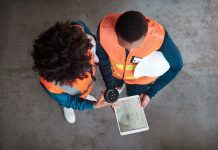 Integrating ERP and CRM could be an AEC firm’s biggest tech value-add High angle shot of two young women using a digital tablet together in a factory, representing ERP and CRM